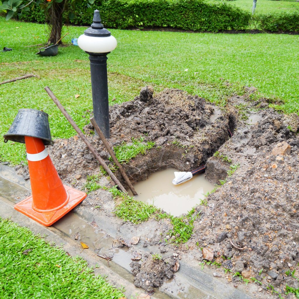 Sewer supply system water tube underground leak on lawn.